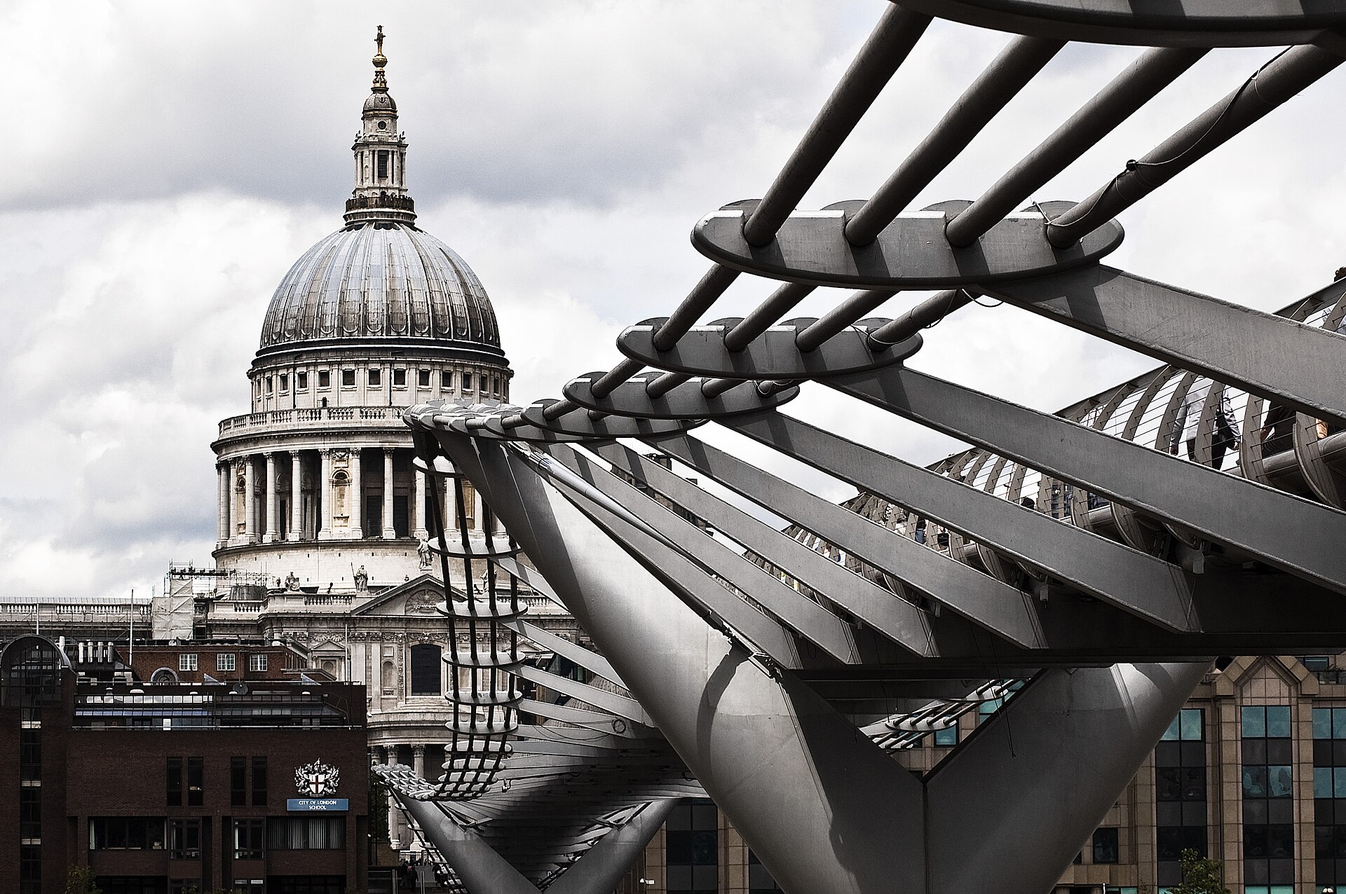 The dome of St Paul&rsquo;s Cathedral seen through the steel structure of the Millennium Bridge, London